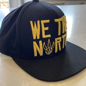 Mitchell & Ness We The North Raptors snap back hat in black and gold
